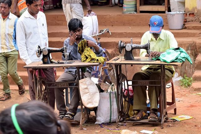 On the spot tailoring is one of the features of this market. Stitching blouses, shirts and bags at breakneck speed made for this picture.